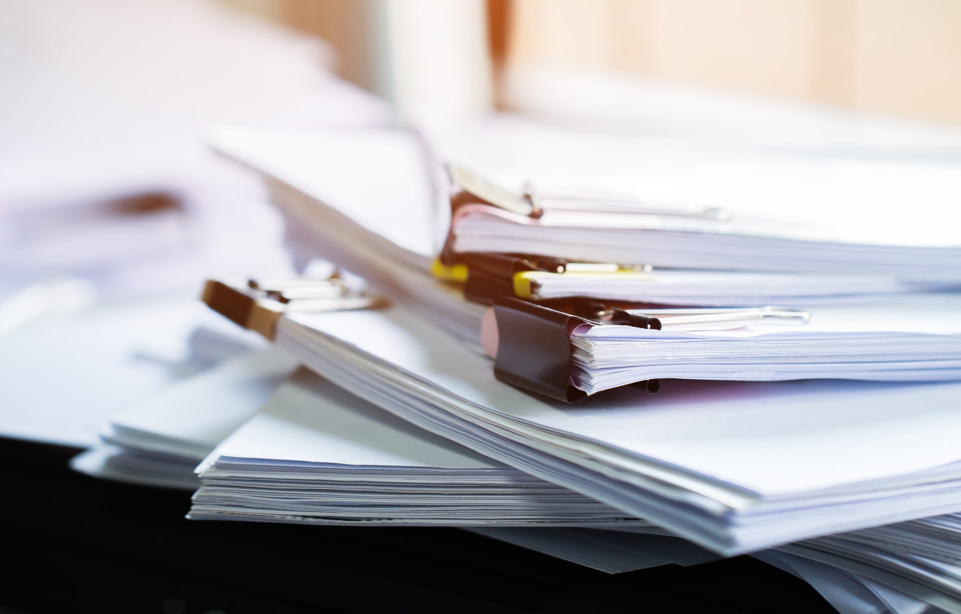 Statistics docs and book in dim room